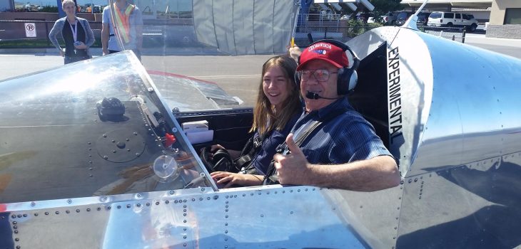 Student pilot with instructor in airplane