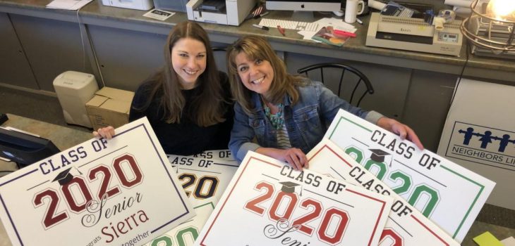 Print shop owners display class of 2020 graduate signs