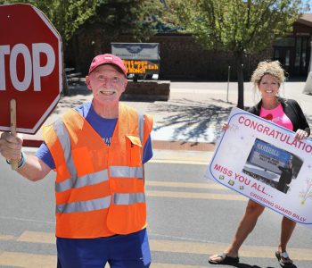 Crossing guard Billy Weldon stands in front of Marshall Elementary School